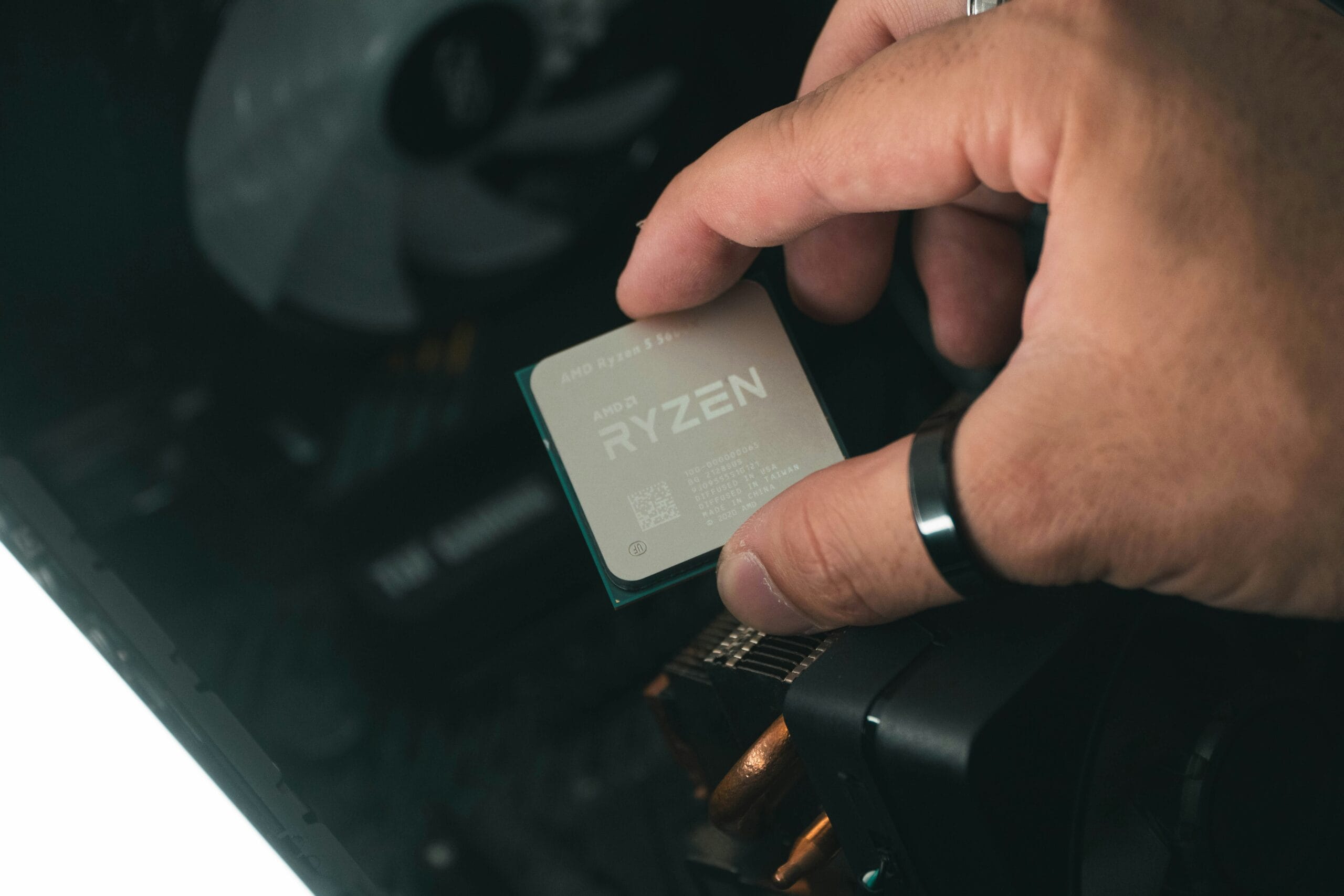 man holding Ryzen processor